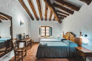 Postel nebo postele na pokoji v ubytování Hotel Rural El Horcajo de Ronda