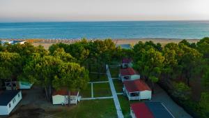 an aerial view of a beach with houses and trees at HILLS RESORT Beach, Bungalows and Bar - Velika Plaza Ulcinj in Ulcinj