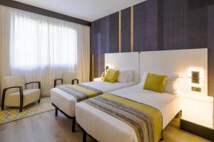Postel nebo postele na pokoji v ubytování Savhotel Fiera Bologna