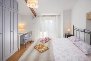 Кровать или кровати в номере Casa Vita Holiday Home