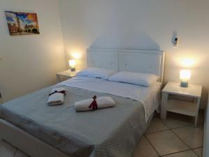 Postel nebo postele na pokoji v ubytování CASA VACANZE I MORI