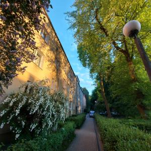 a street light on a sidewalk next to a building at Mieszkanie Wieniawa in Lublin