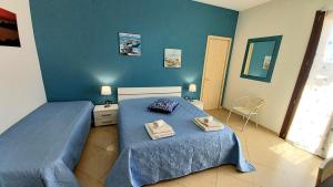 Postel nebo postele na pokoji v ubytování B&B Colori del Salento