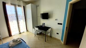 TV a/nebo společenská místnost v ubytování B&B Colori del Salento