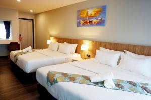 Postel nebo postele na pokoji v ubytování FLYPOD Hotel