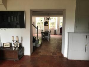 a living room with a table and a dining room at Maison vigneronne in Montlaur