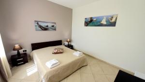 Postel nebo postele na pokoji v ubytování B&B Colori del Salento