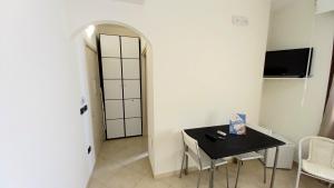 TV a/nebo společenská místnost v ubytování B&B Colori del Salento + 15 fotografií