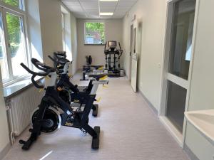 a row of exercise bikes in a hallway at Best Western Valhall Park Hotell in Ängelholm