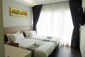 Postel nebo postele na pokoji v ubytování FLYPOD Hotel