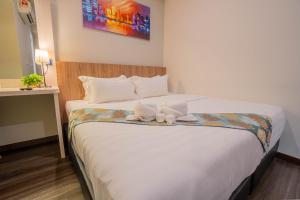 Postel nebo postele na pokoji v ubytování FLYPOD Hotel