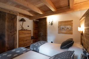 Posteľ alebo postele v izbe v ubytovaní Chalet degli Abeti by AMA Val di Fassa