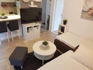 a living room with a couch and a table at Apartment Silvija in Makarska