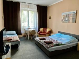 Posedenie v ubytovaní Bon Voyage Apartments