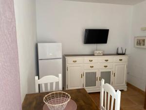 Telewizja i/lub zestaw kina domowego w obiekcie Center Holiday Corralejo 2