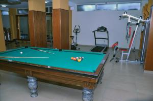 a room with a pool table and some exercise equipment at Hotel Vila Lule in Durrës