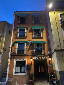 a building with a hostel on the side of it at Hostal Calderon Cuenca in Cuenca