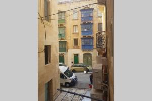 a view of a parking lot from a building at Valletta Malta in Il-Furjana