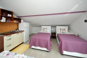 Postel nebo postele na pokoji v ubytování Apartments Roza
