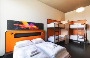 Cama ou camas em um quarto em MEININGER Hotel Genève Centre Charmilles