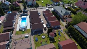 a model of a house with a swimming pool at Domki Letniskowe Marzena in Międzyzdroje