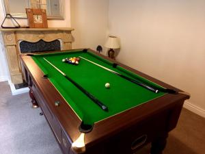 a pool table with balls on top of it at Castle Gate House Derry City Centre Townhouse STILL OPEN in Derry Londonderry