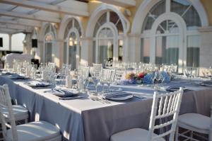 a long table with glasses and napkins on it at Golf Villa in Lighthouse Golf & SPA Resort in Balchik +23 photos