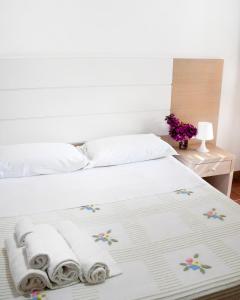 Posteľ alebo postele v izbe v ubytovaní Favignana Casa Vacanza Orsola