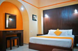 Postel nebo postele na pokoji v ubytování Hotel Casa Rico
