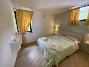 Ένα ή περισσότερα κρεβάτια σε δωμάτιο στο Nonna Rosa House Ravello