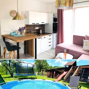 a kitchen and a living room with a pool at Apartmany Central Liptov in Liptovský Mikuláš