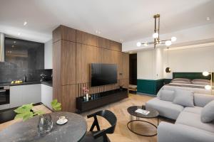 TV a/nebo společenská místnost v ubytování Borgo Apartment