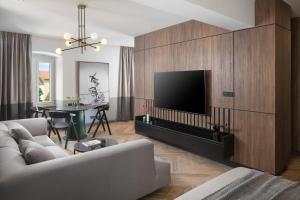 Televízia a/alebo spoločenská miestnosť v ubytovaní Borgo Apartment
