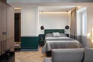 Säng eller sängar i ett rum på Borgo Apartment
