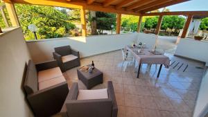 an outdoor patio with a table and chairs at Meraviglia d'Otranto in Otranto