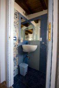 a bathroom with a sink and a toilet at Sicilia Ovest - Sea View Balcony Cerri in Castellammare del Golfo +11 photos