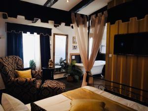 Televízia a/alebo spoločenská miestnosť v ubytovaní Bed&Breakfast Andio