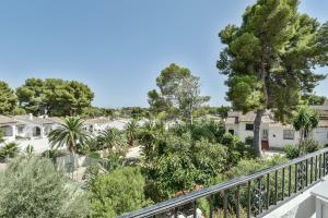 a view from the balcony of a house with trees at Modern stylish bungalow in Moraira in Moraira