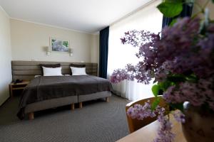 Postel nebo postele na pokoji v ubytování Spa Hotel Ezeri