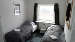 Katil atau katil-katil dalam bilik di Hotel Nordlys