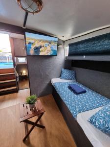 A bed or beds in a room at Experiencia en el mar Gijon C