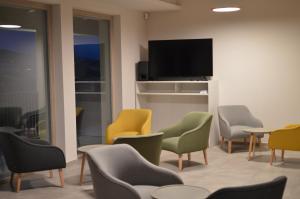 A television and/or entertainment centre at RESORT REIS country house