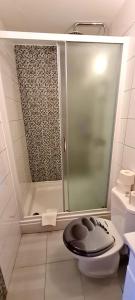 a small bathroom with a shower and a toilet at Bed & Breakfast Dionis Vis in Vis +39 photos