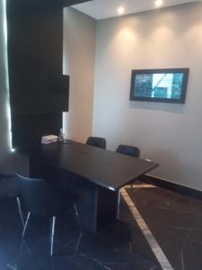 Телевизор и/или развлекательный центр в Edf Time - conforto e sofisticação
