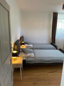 A bed or beds in a room at Apartment Ďumbier