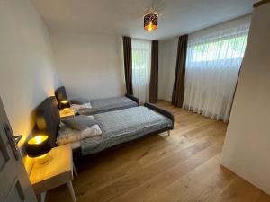 A bed or beds in a room at Apartment Ďumbier