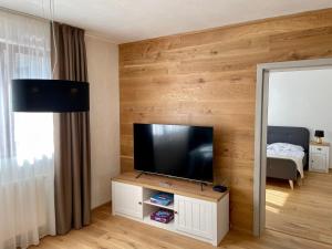 A television and/or entertainment centre at Apartment Ďumbier