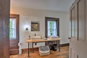 a bathroom with a sink and a mirror at Timeless Winesburg House with Private Balcony in Dundee