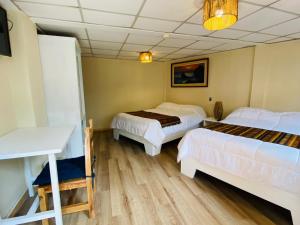 Letto o letti in una camera di Hostal Alcala