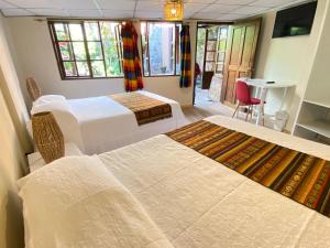 Letto o letti in una camera di Hostal Alcala